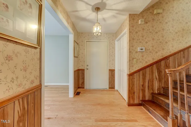 a view of entryway with wooden floor