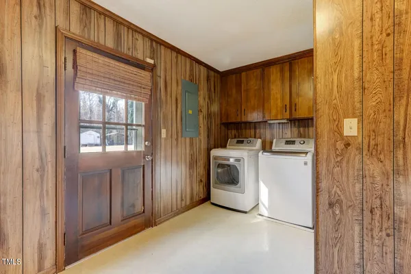 an empty room with a view of front door