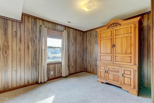 a bathroom with a sink a toilet and shower curtain