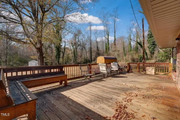 a view of road with large trees