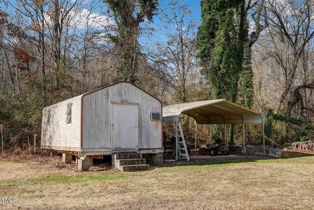 a view of road with large trees