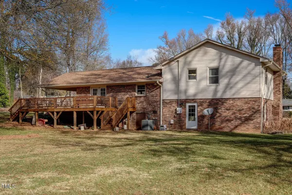 an aerial view of a houses with a yard