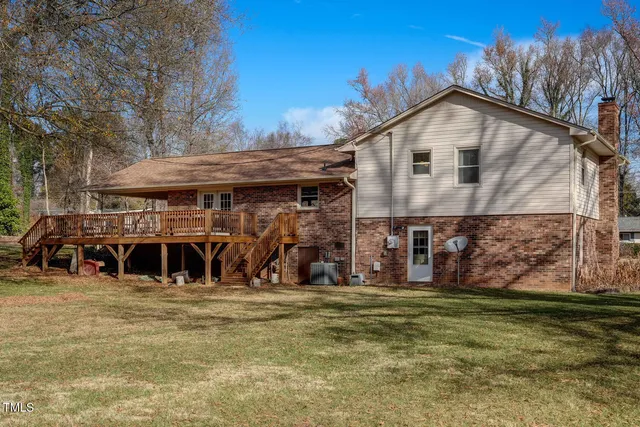 an aerial view of a houses with a yard