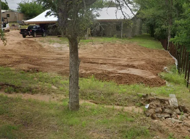 a backyard of a house with lots of green space