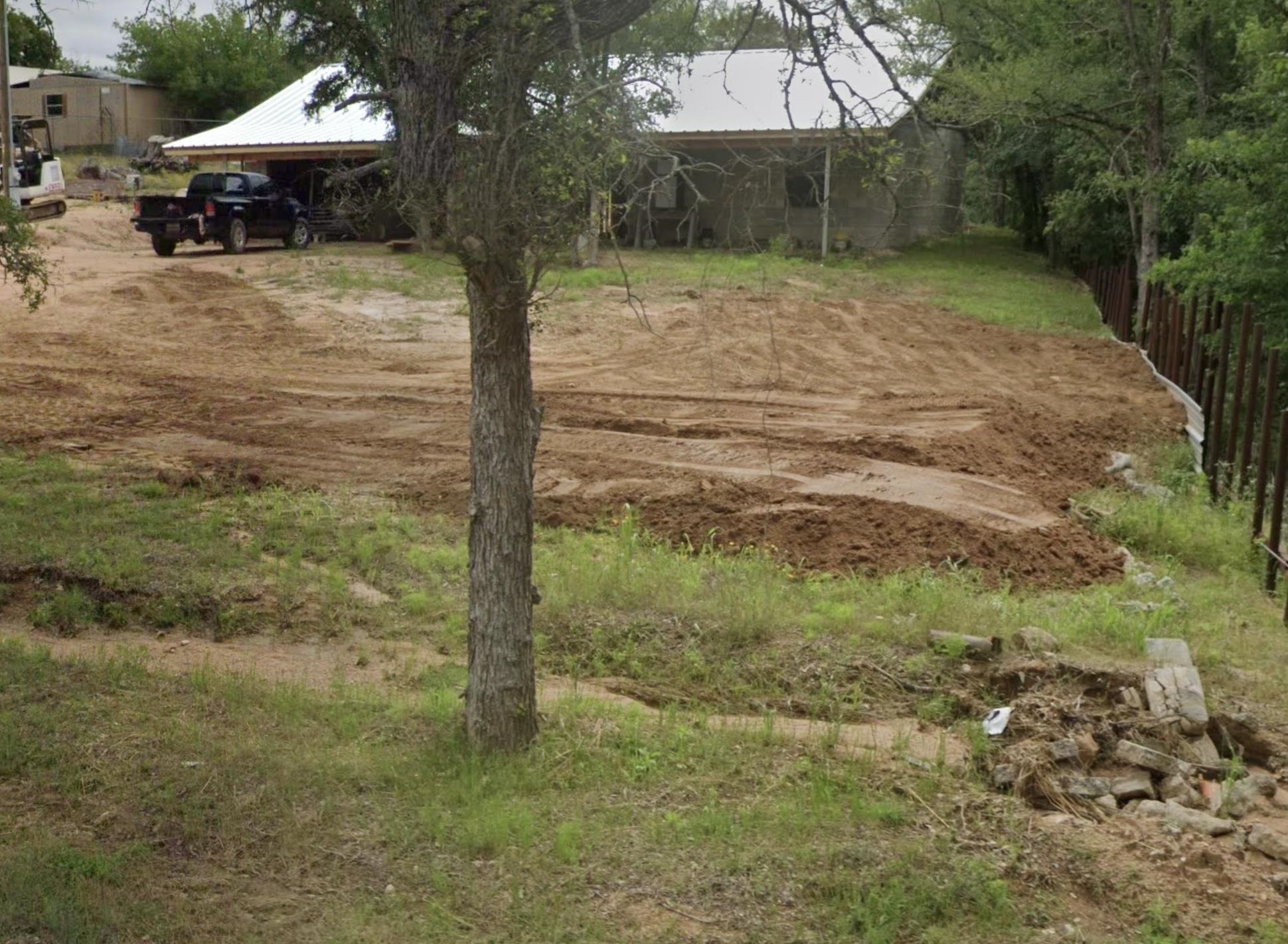 a backyard of a house with lots of green space