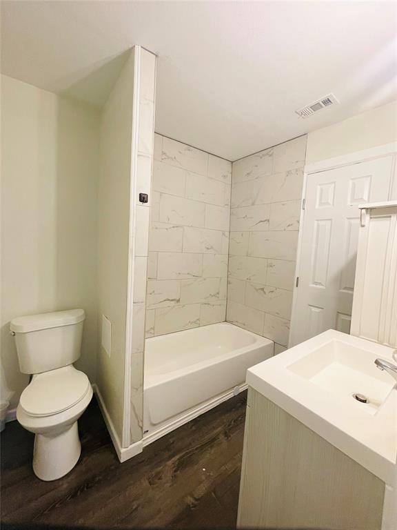 111 Rousseau Street Waxahachie, TX 75165 - Photo 12 of 22 a bathroom with a sink a toilet and shower