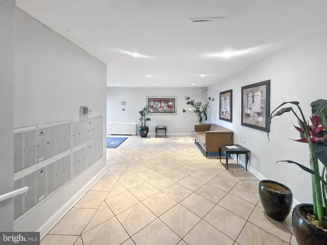 a bed room with a bed and a chair