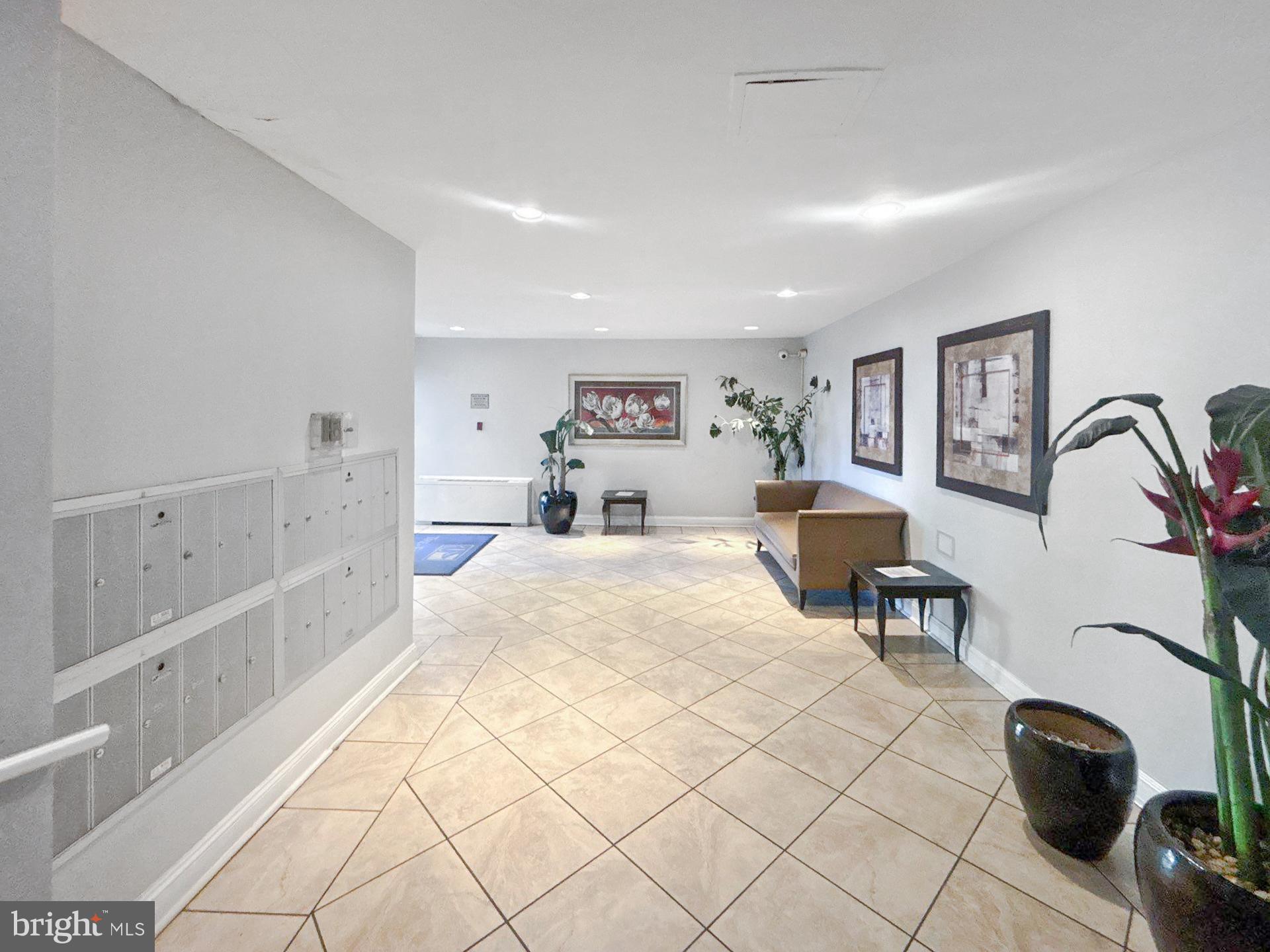 1005 Chillum Road, Unit 317 Hyattsville, MD 20782 - Photo 2 of 9 a bed room with a bed and a chair