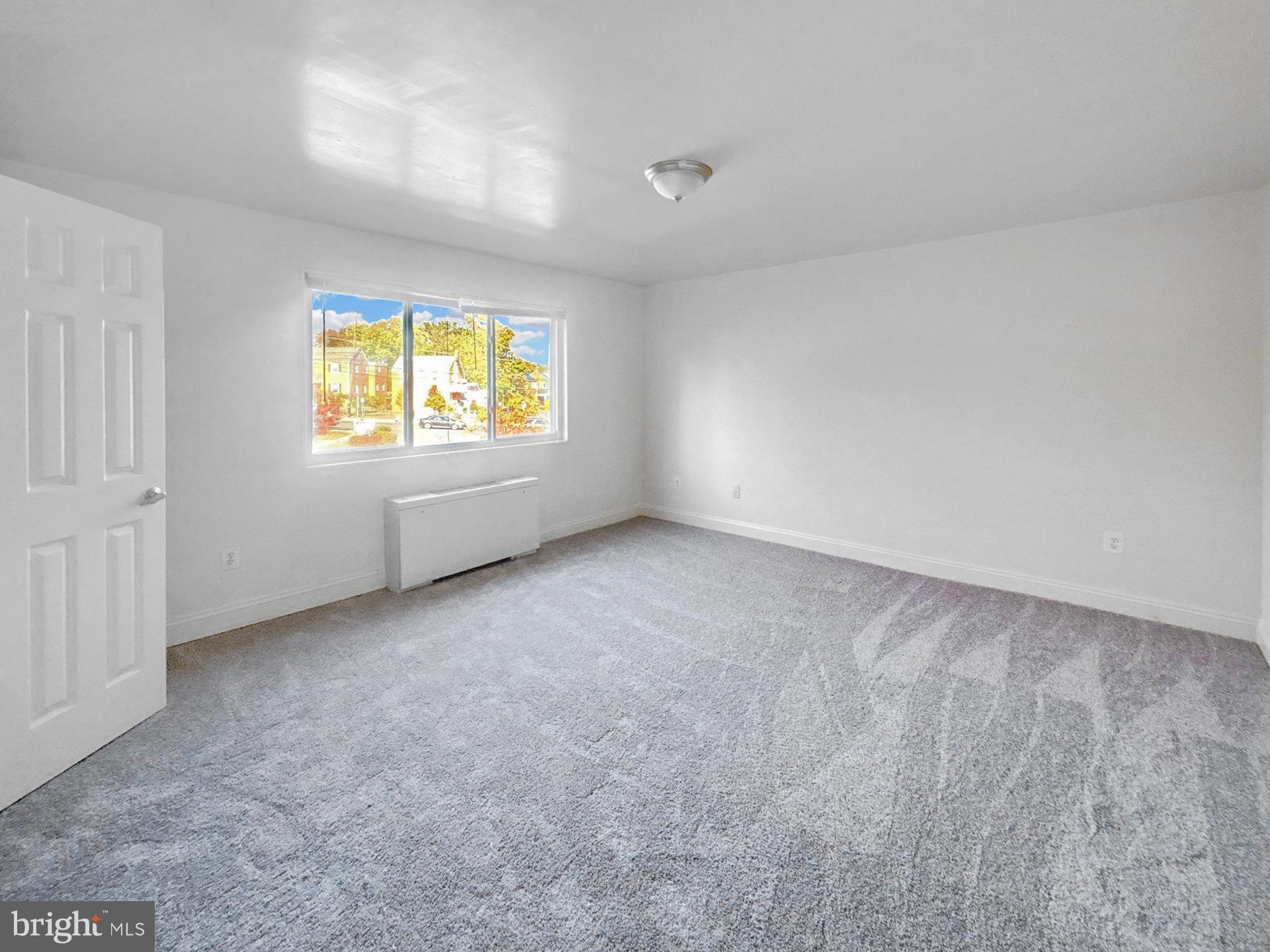 1005 Chillum Road, Unit 317 Hyattsville, MD 20782 - Photo 5 of 9 an empty room with windows