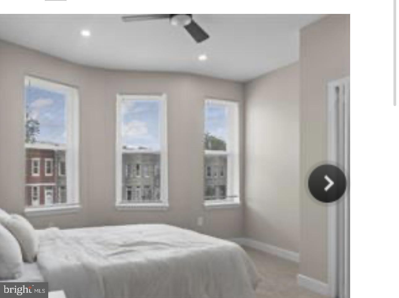 2022 North Fulton Avenue Baltimore, MD 21217 - Photo 6 of 11 a bedroom with a bed and a large window