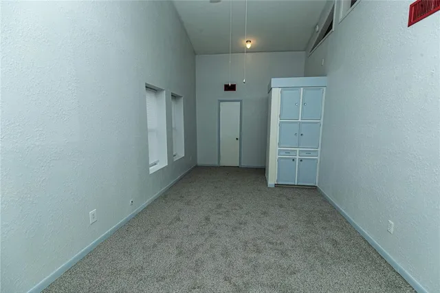 an empty room with closet area