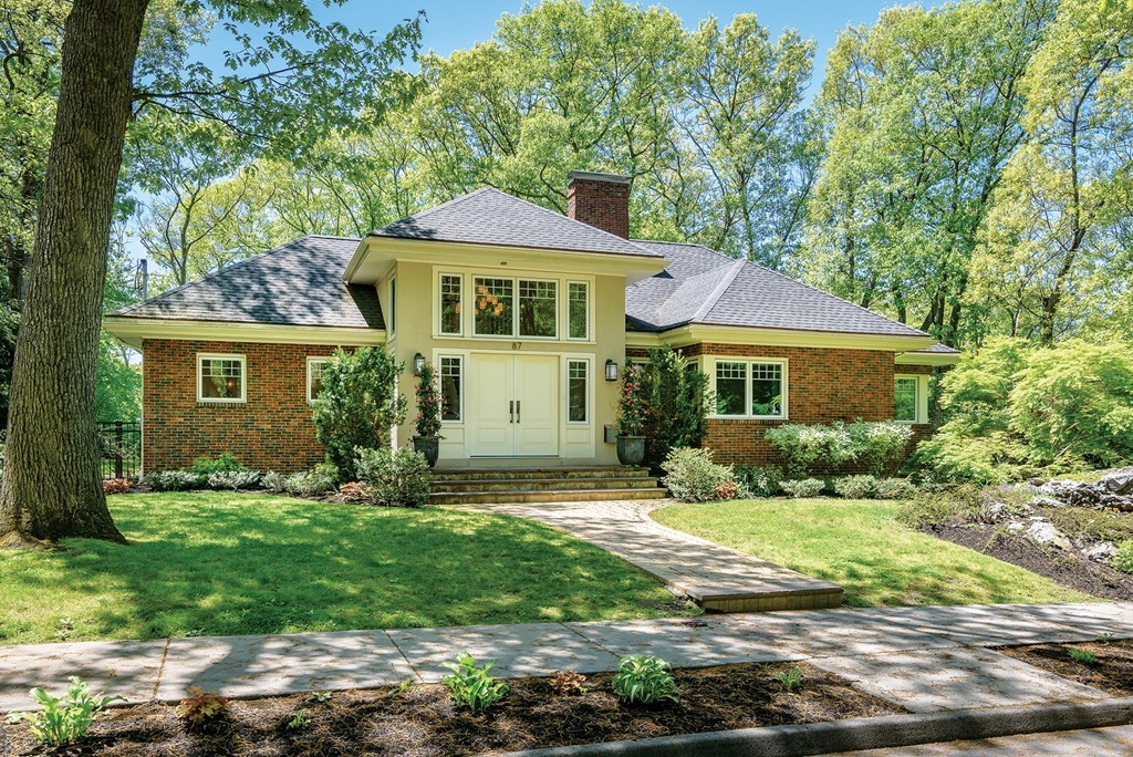 87 Beverly Road Brookline, MA 02467 - Photo 1 of 16 a front view of a house with a yard