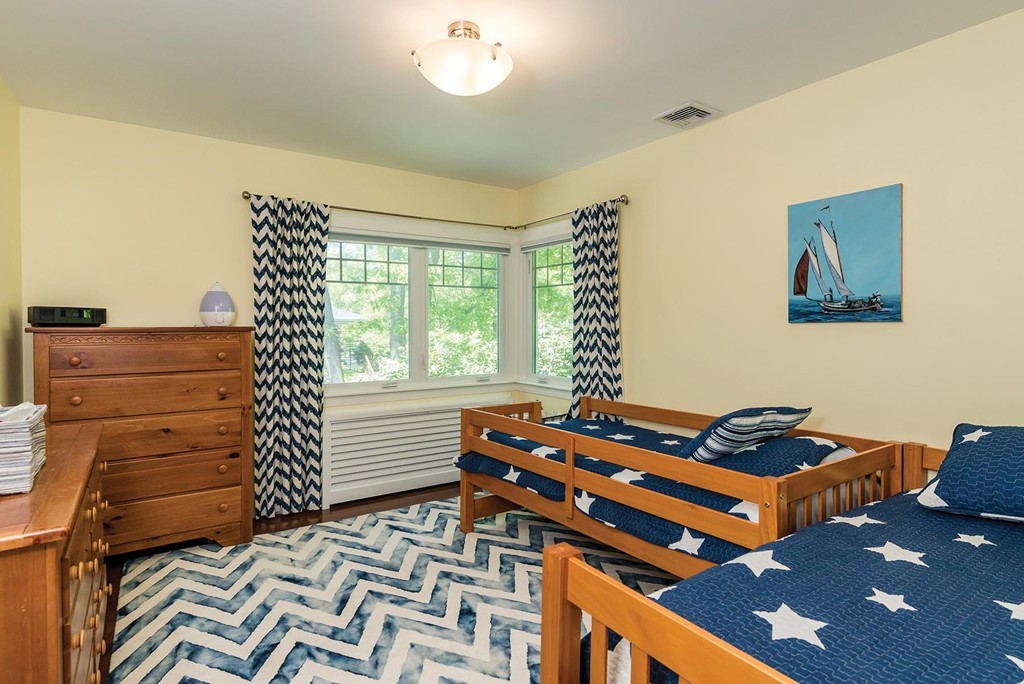 87 Beverly Road Brookline, MA 02467 - Photo 13 of 16 a bedroom with a bed and a window