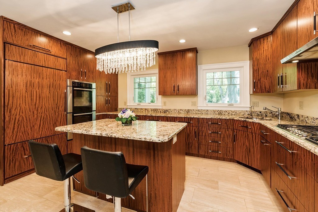 87 Beverly Road Brookline, MA 02467 - Photo 5 of 16 a kitchen with stainless steel appliances granite countertop a sink stove and refrigerator