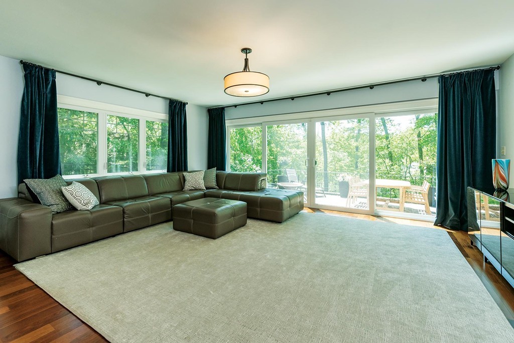 87 Beverly Road Brookline, MA 02467 - Photo 7 of 16 a living room with furniture and a large window