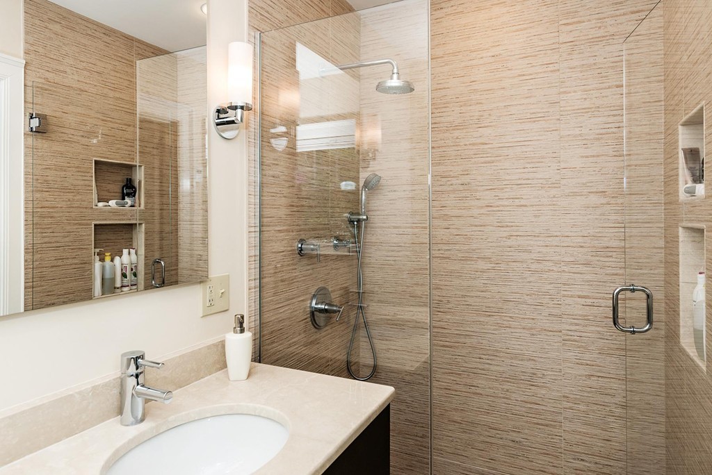 87 Beverly Road Brookline, MA 02467 - Photo 9 of 16 a bathroom with a sink a toilet and shower
