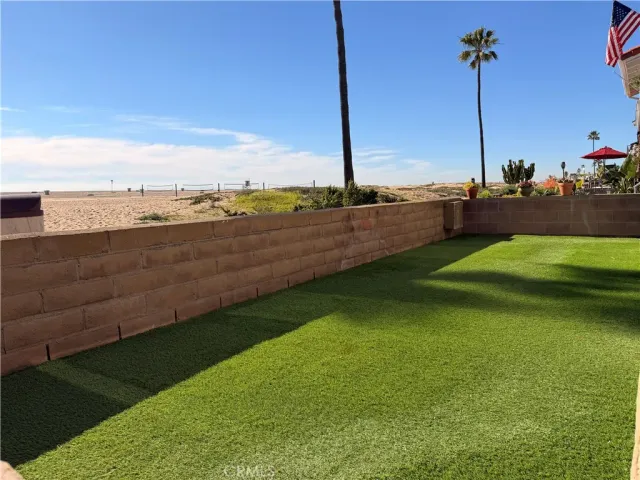 a view of a golf course with a lake view