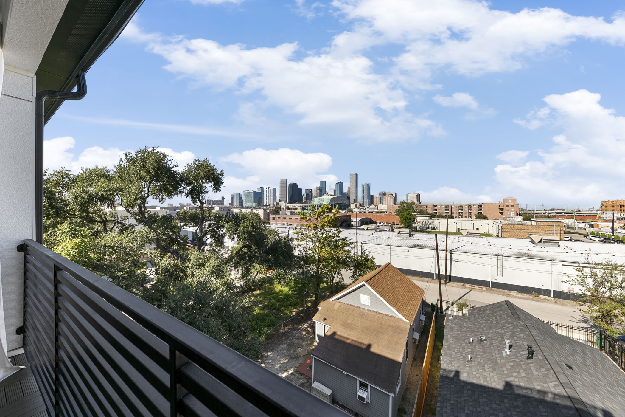 2412 Canal Street, Unit J Houston, TX 77003 - Photo 15 of 19 a view of a city from a balcony