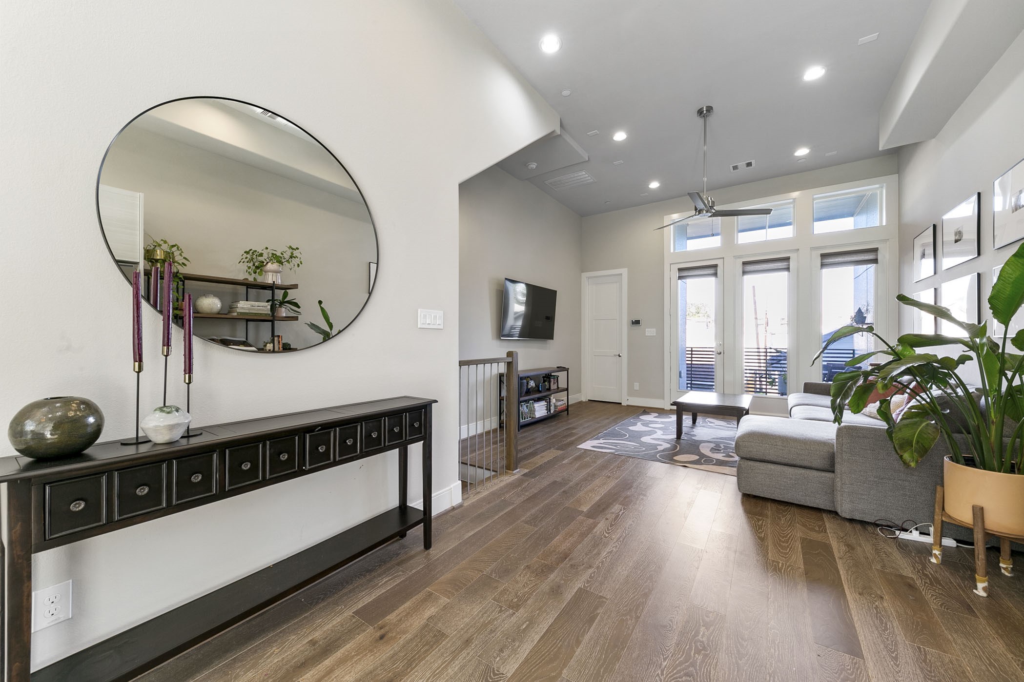 2412 Canal Street, Unit J Houston, TX 77003 - Photo 7 of 19 a living room with furniture and a wooden floor