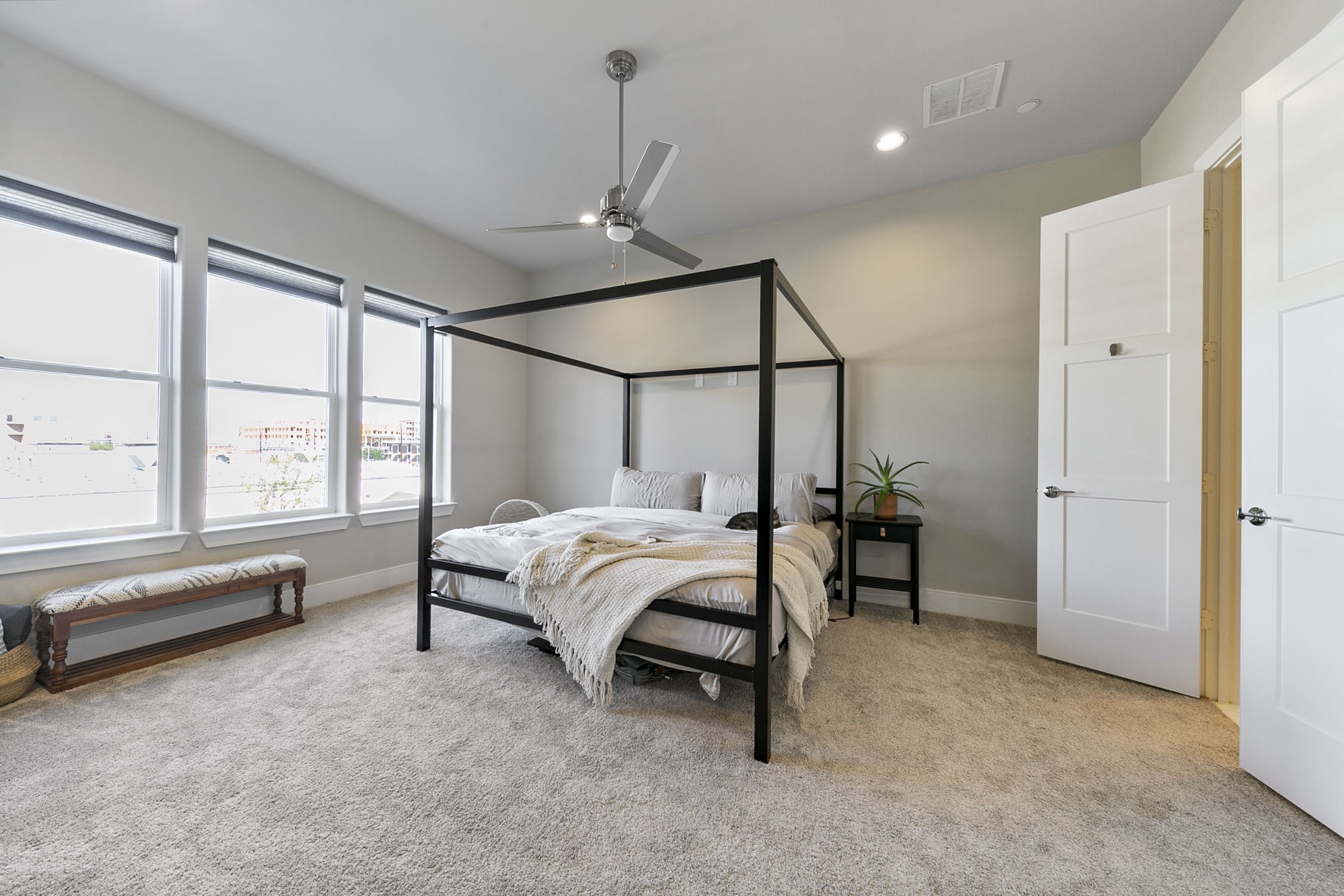 2412 Canal Street, Unit J Houston, TX 77003 - Photo 8 of 19 a bed room with a bed and a window