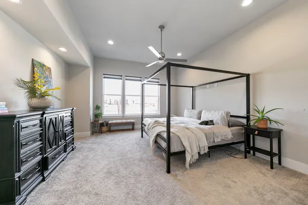 a bed room with a bed and a window