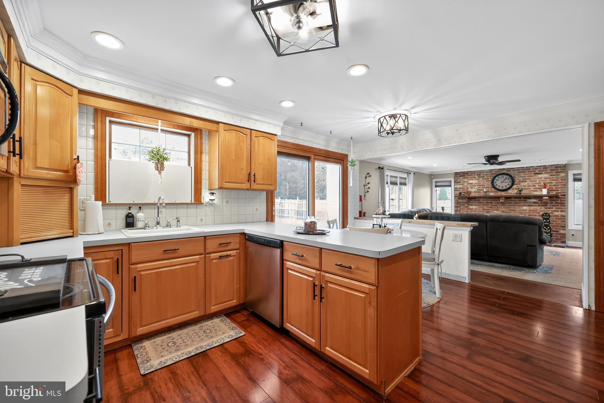 665 Chatham Road Somerdale, NJ 08083 - Photo 13 of 36 a kitchen with a stove a sink and a refrigerator