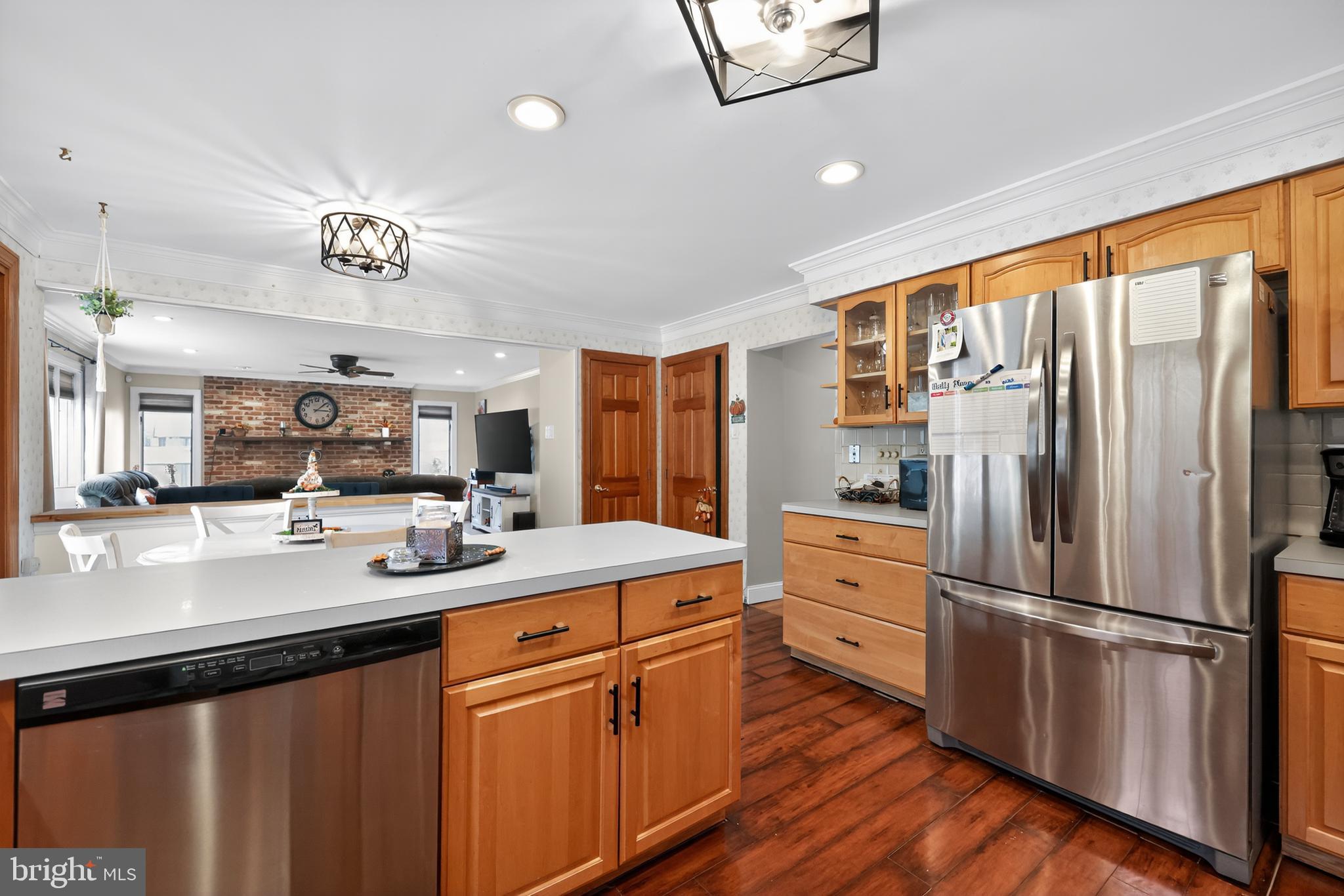 665 Chatham Road Somerdale, NJ 08083 - Photo 15 of 36 a kitchen with white cabinets and stainless steel appliances