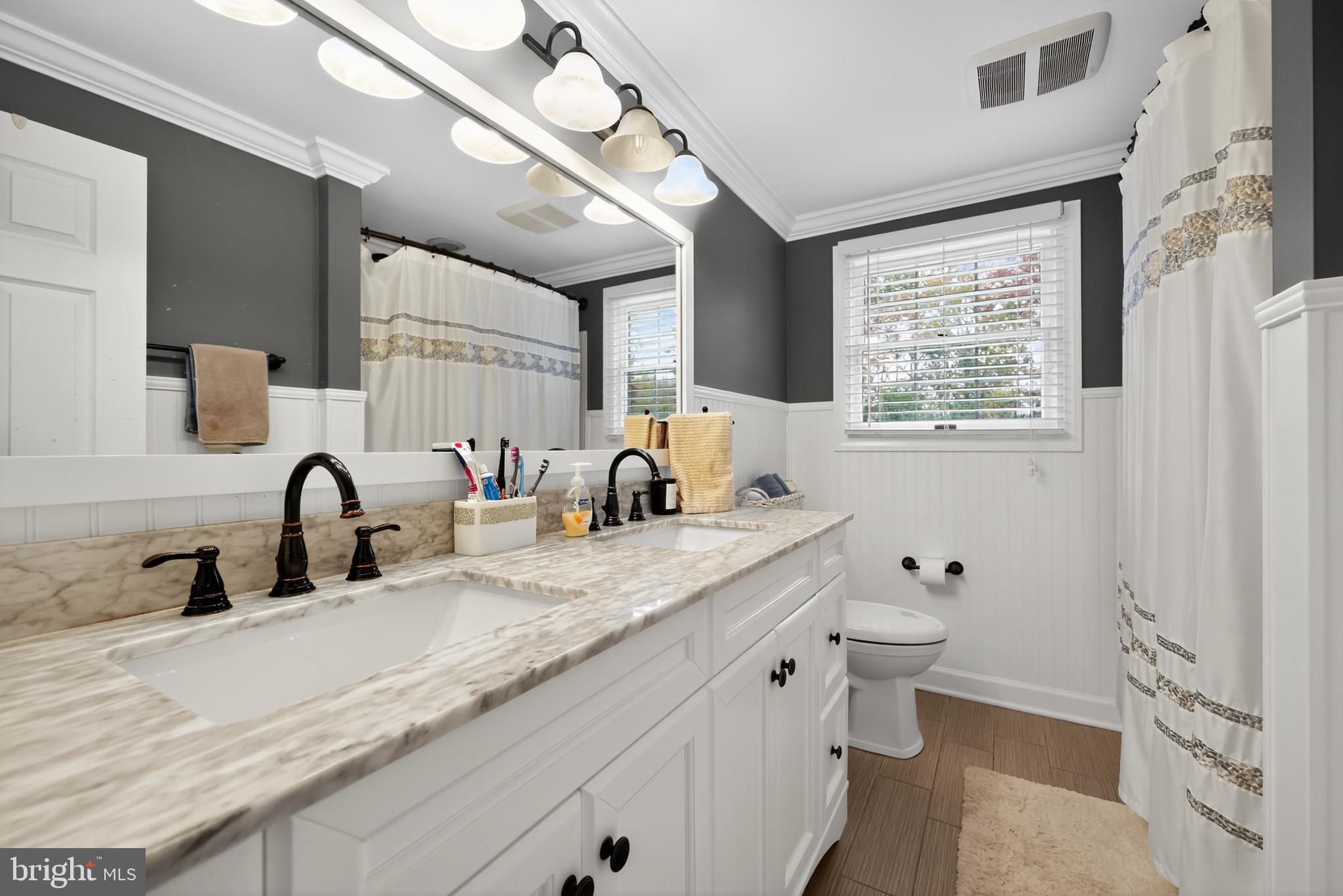 665 Chatham Road Somerdale, NJ 08083 - Photo 17 of 36 a bathroom with a granite countertop sink mirror vanity and toilet
