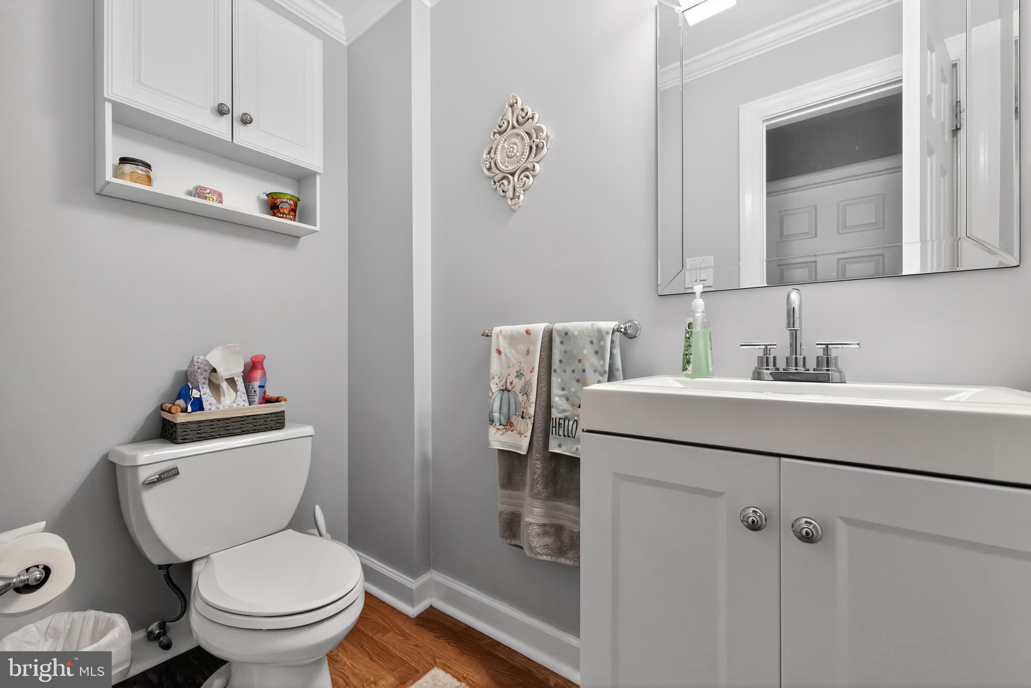 665 Chatham Road Somerdale, NJ 08083 - Photo 18 of 36 a bathroom with a toilet a sink and mirror