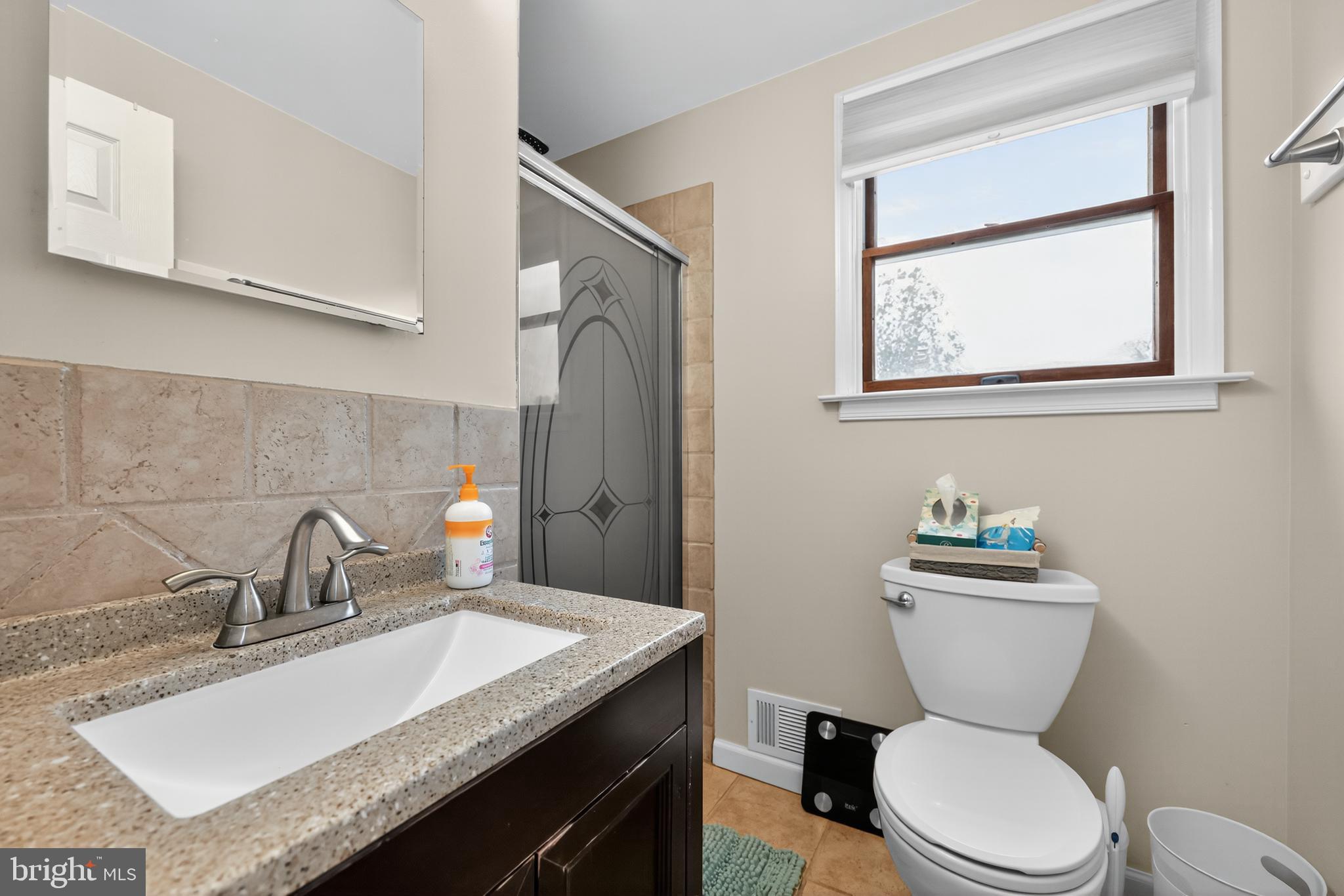 665 Chatham Road Somerdale, NJ 08083 - Photo 22 of 36 a bathroom with a granite countertop toilet sink and mirror