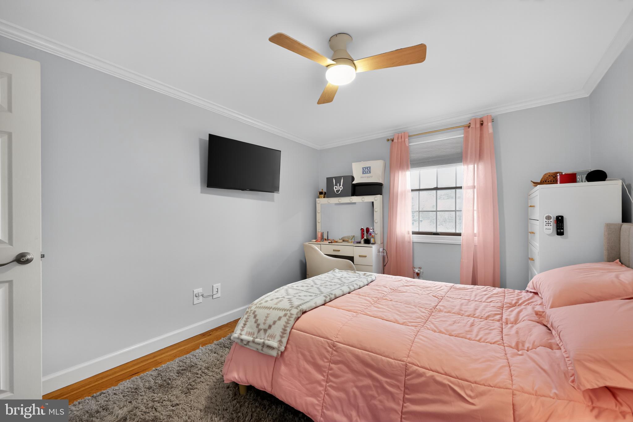 665 Chatham Road Somerdale, NJ 08083 - Photo 23 of 36 a bedroom with a large bed and a flat screen tv