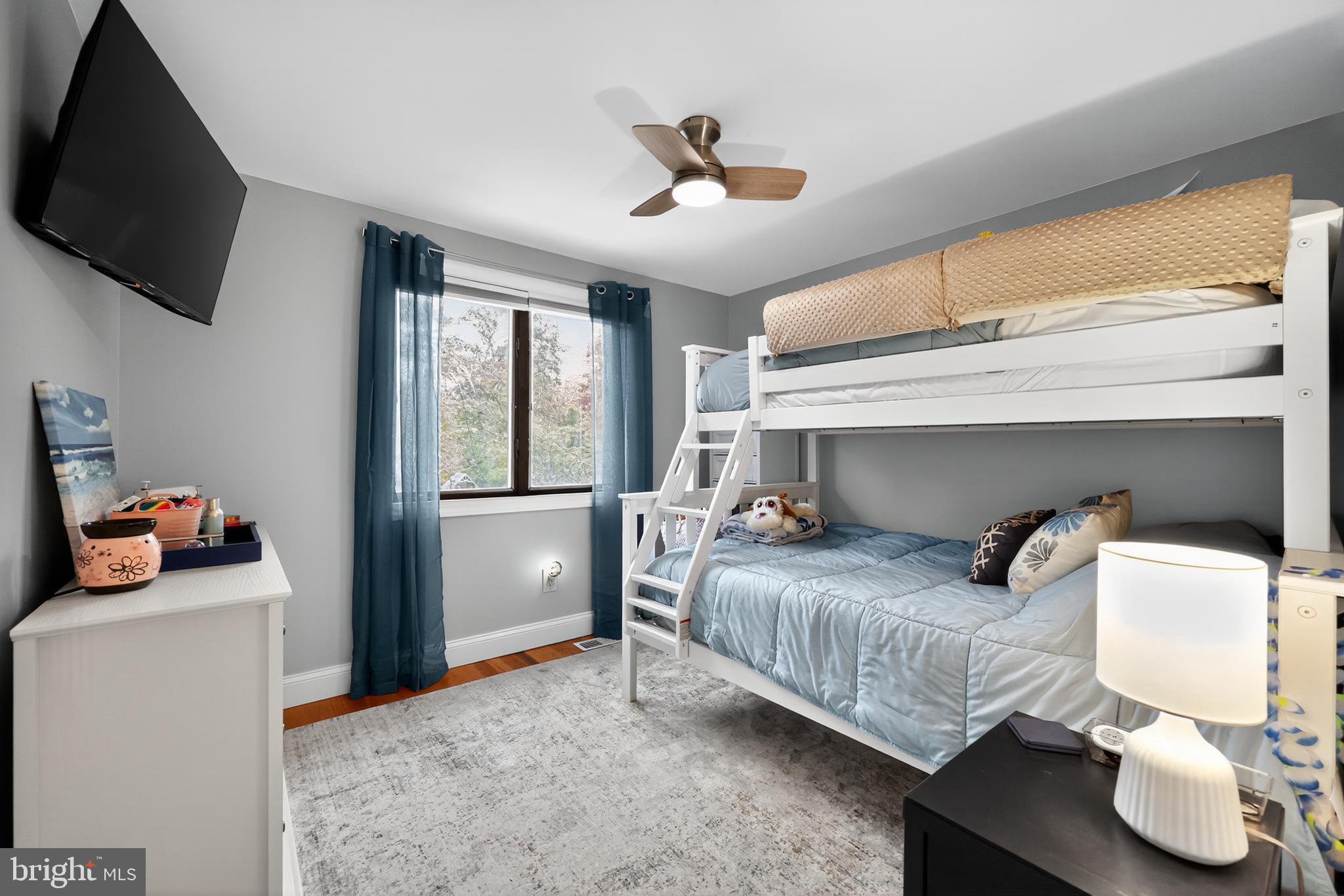 665 Chatham Road Somerdale, NJ 08083 - Photo 25 of 36 a bedroom with a bed and a flat tv screen on the dresser