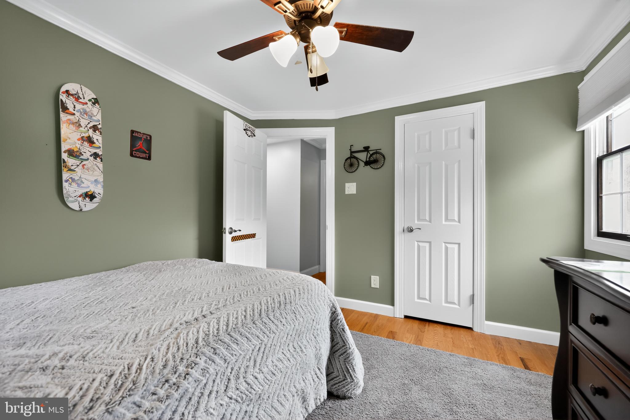 665 Chatham Road Somerdale, NJ 08083 - Photo 28 of 36 a bedroom with a bed and a chandelier
