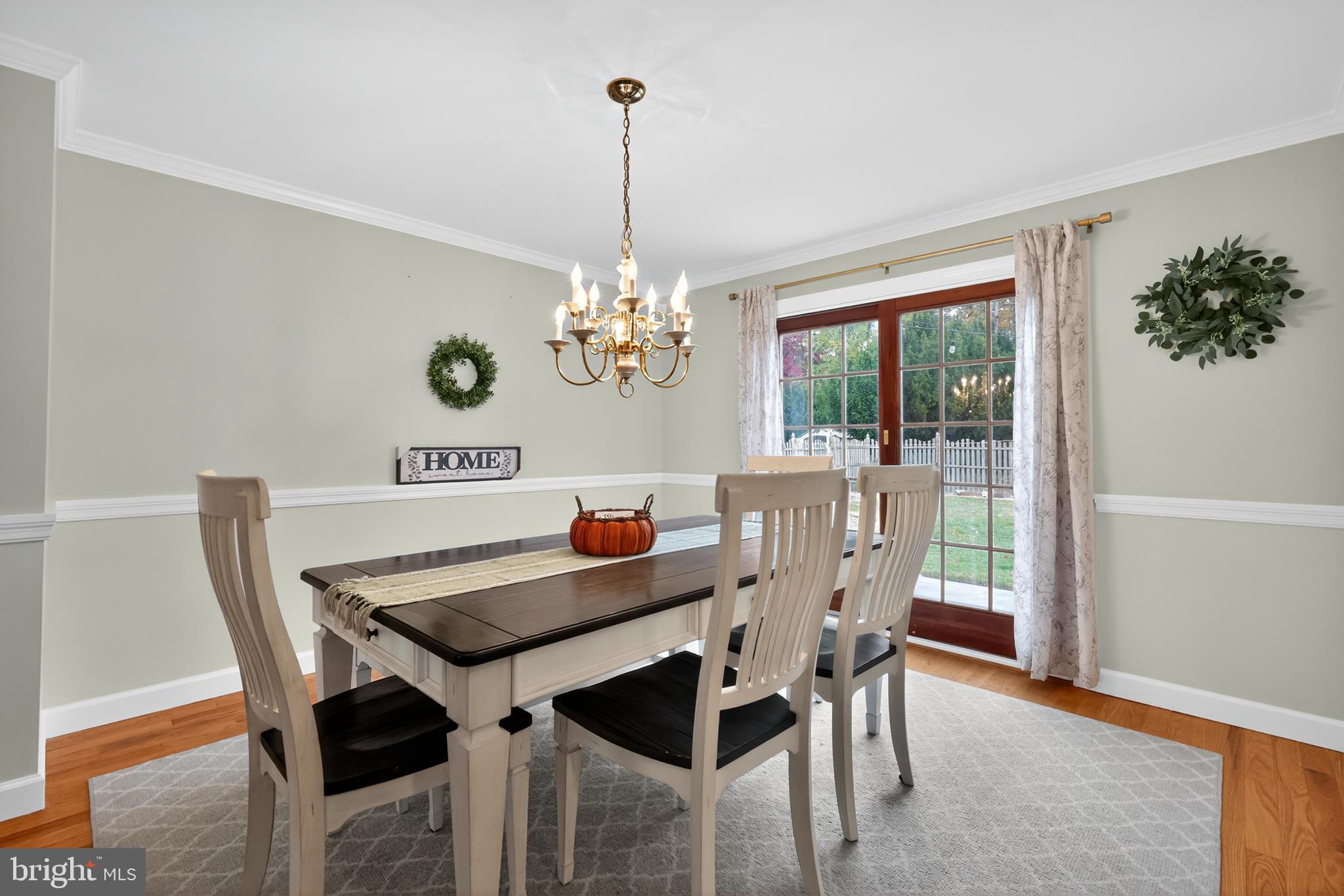665 Chatham Road Somerdale, NJ 08083 - Photo 6 of 36 a view of a dining room with furniture a chandelier and wooden floor