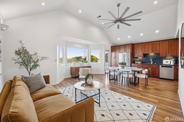 a living room with furniture and a table