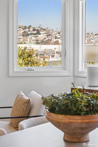 a spacious bedroom with a large bed and windows