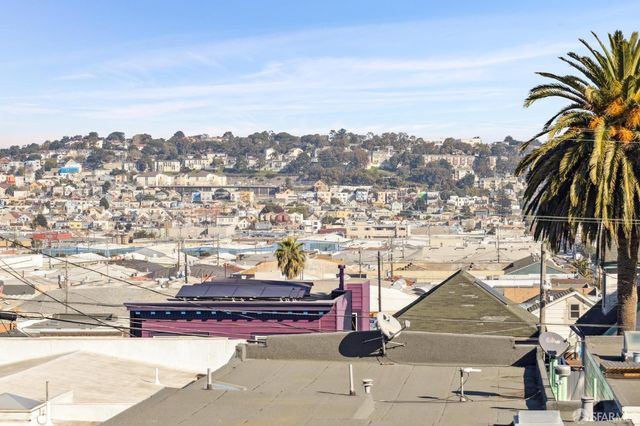 a living room with furniture rug and window