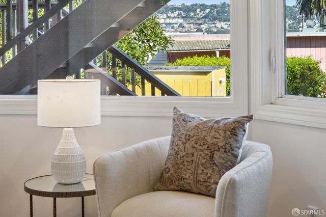 a view of an outdoor sitting area with furniture in the backyard