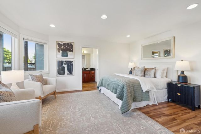 a front view of house with a garden and seating area