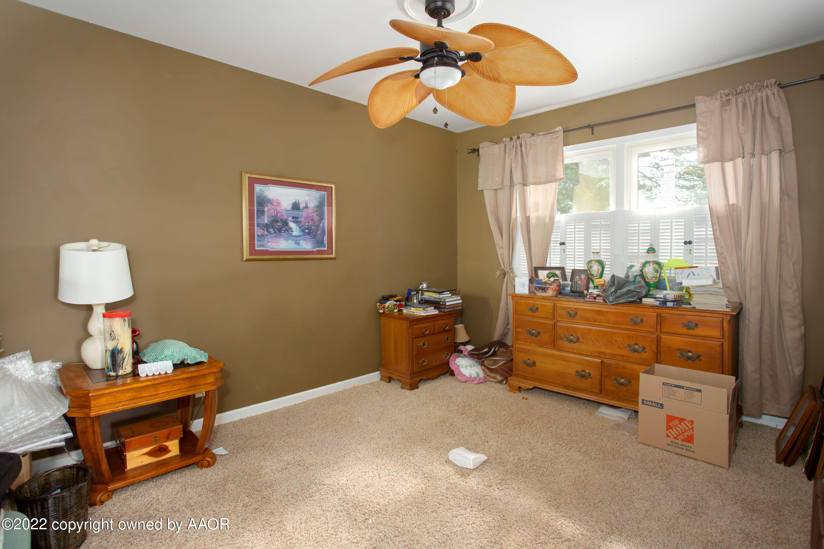 3607 Patterson Drive Amarillo, TX 79109 - Photo 13 of 24 a room with furniture a rug and a window