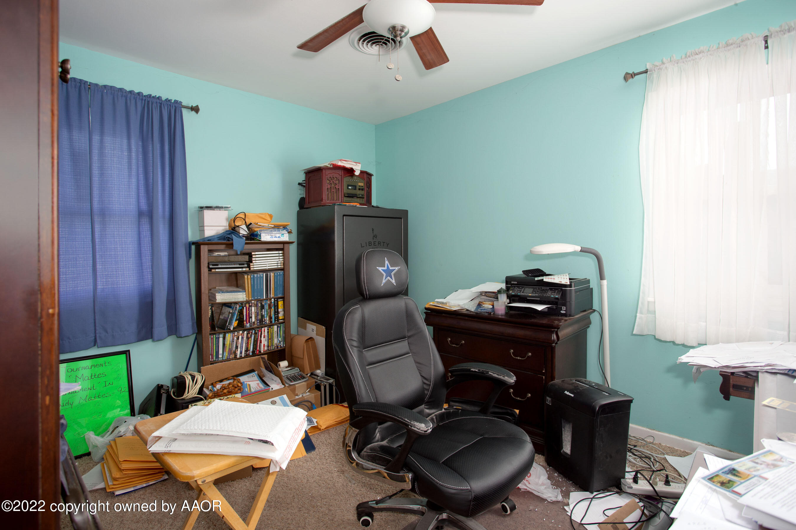 3607 Patterson Drive Amarillo, TX 79109 - Photo 14 of 24 a view of a workspace with furniture and a lamp