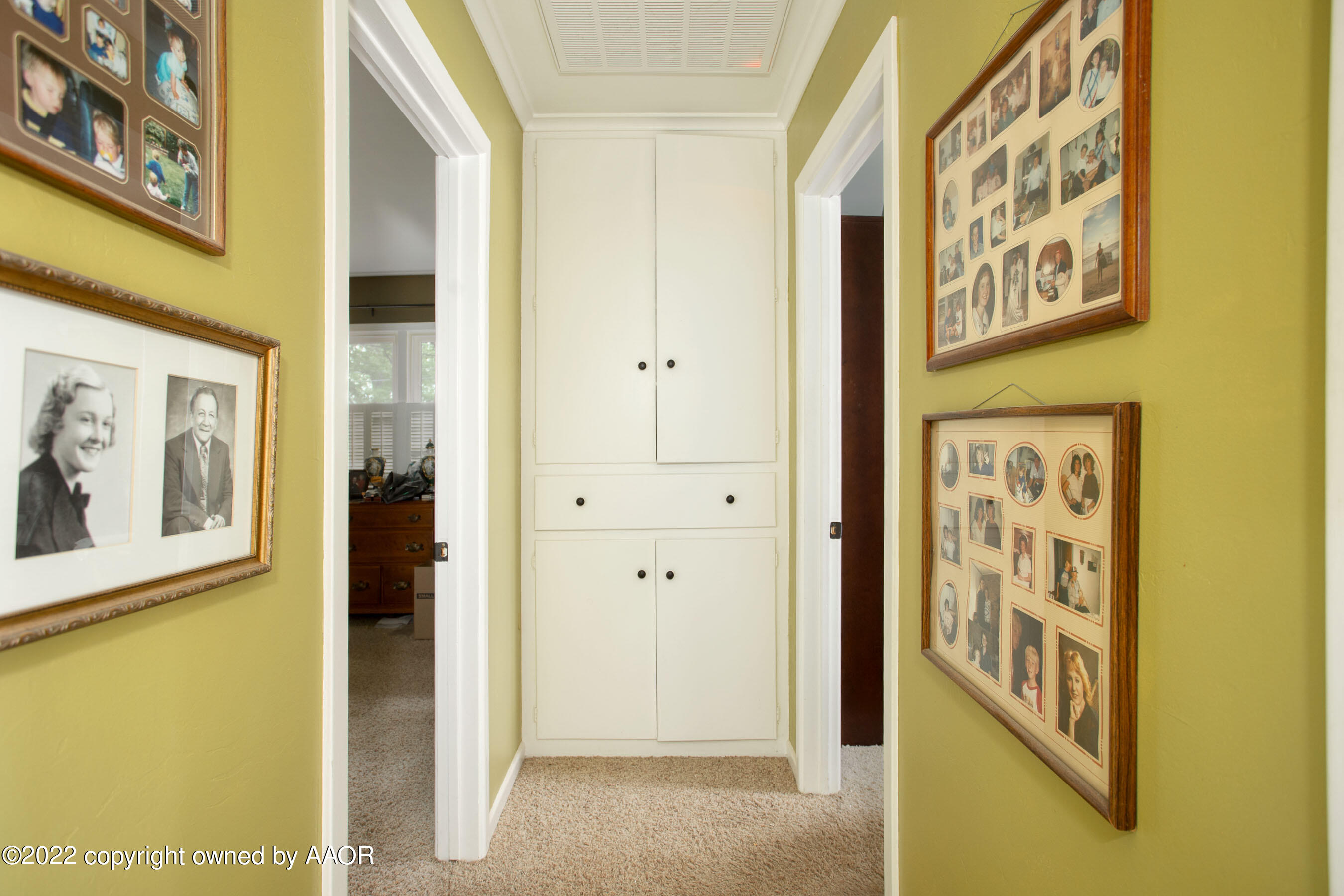 3607 Patterson Drive Amarillo, TX 79109 - Photo 19 of 24 a view of a hallway with a painting on the wall
