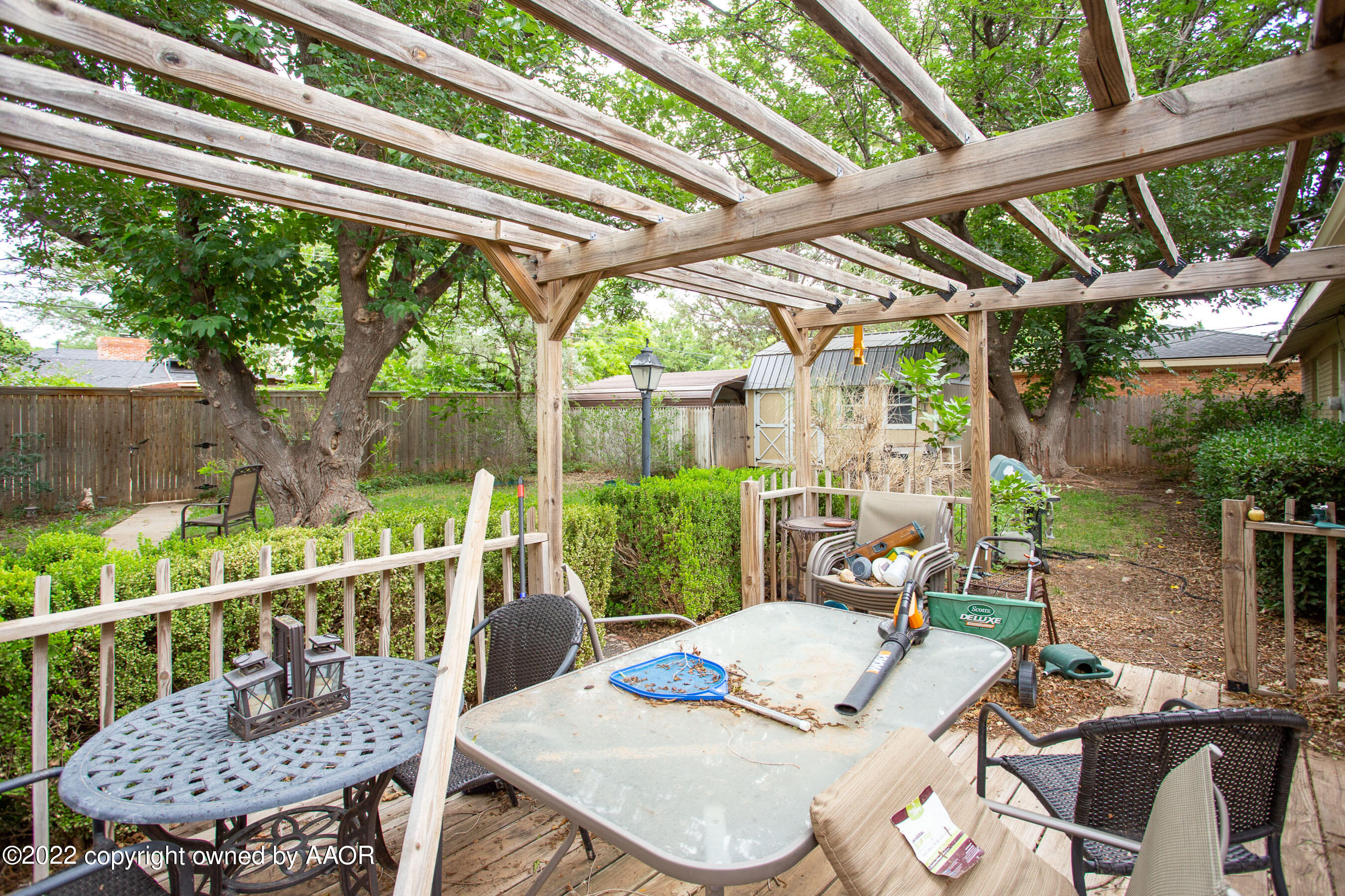 3607 Patterson Drive Amarillo, TX 79109 - Photo 20 of 24 a view of a patio with a table chairs and a backyard