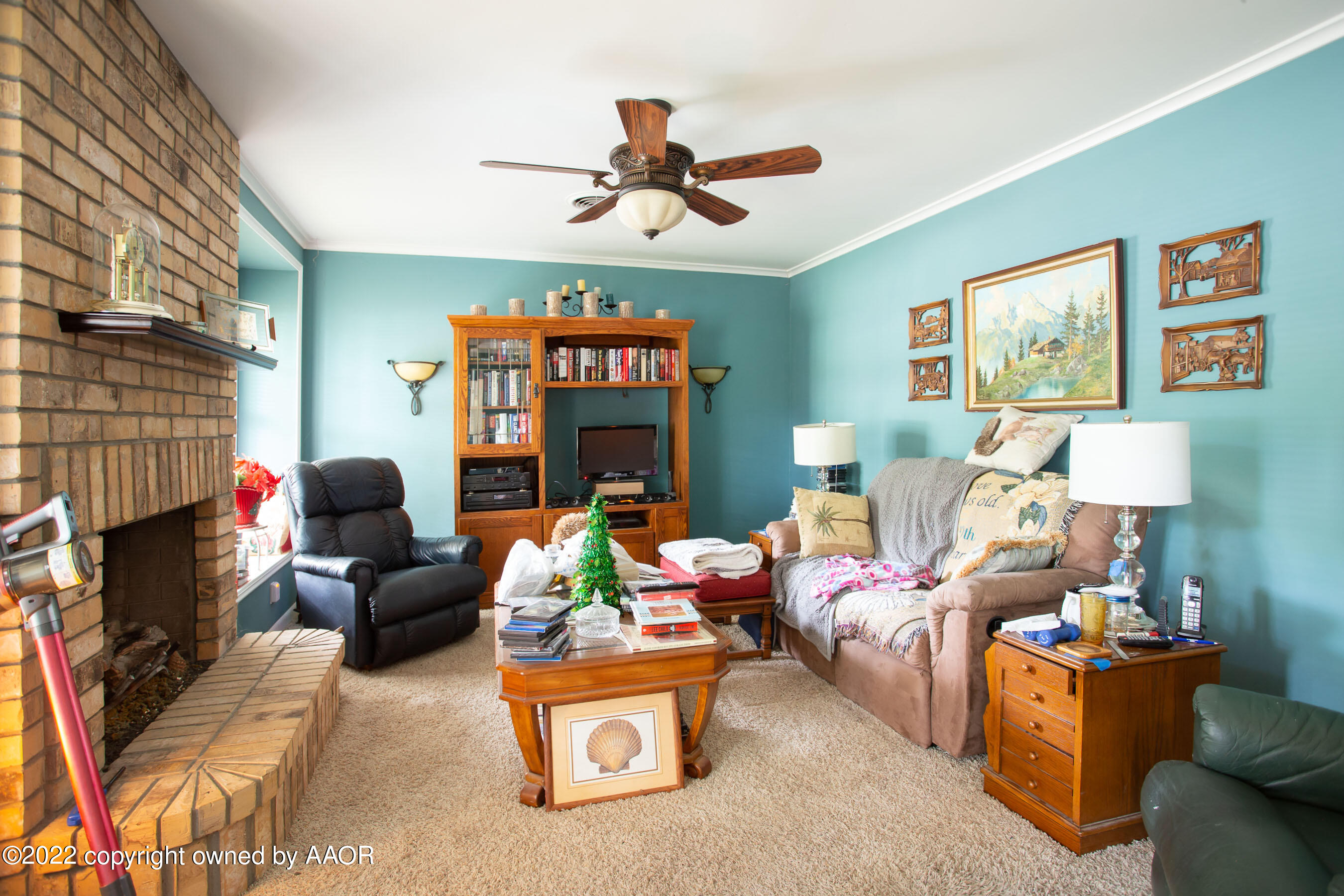 3607 Patterson Drive Amarillo, TX 79109 - Photo 3 of 24 a living room with furniture a fireplace and a window