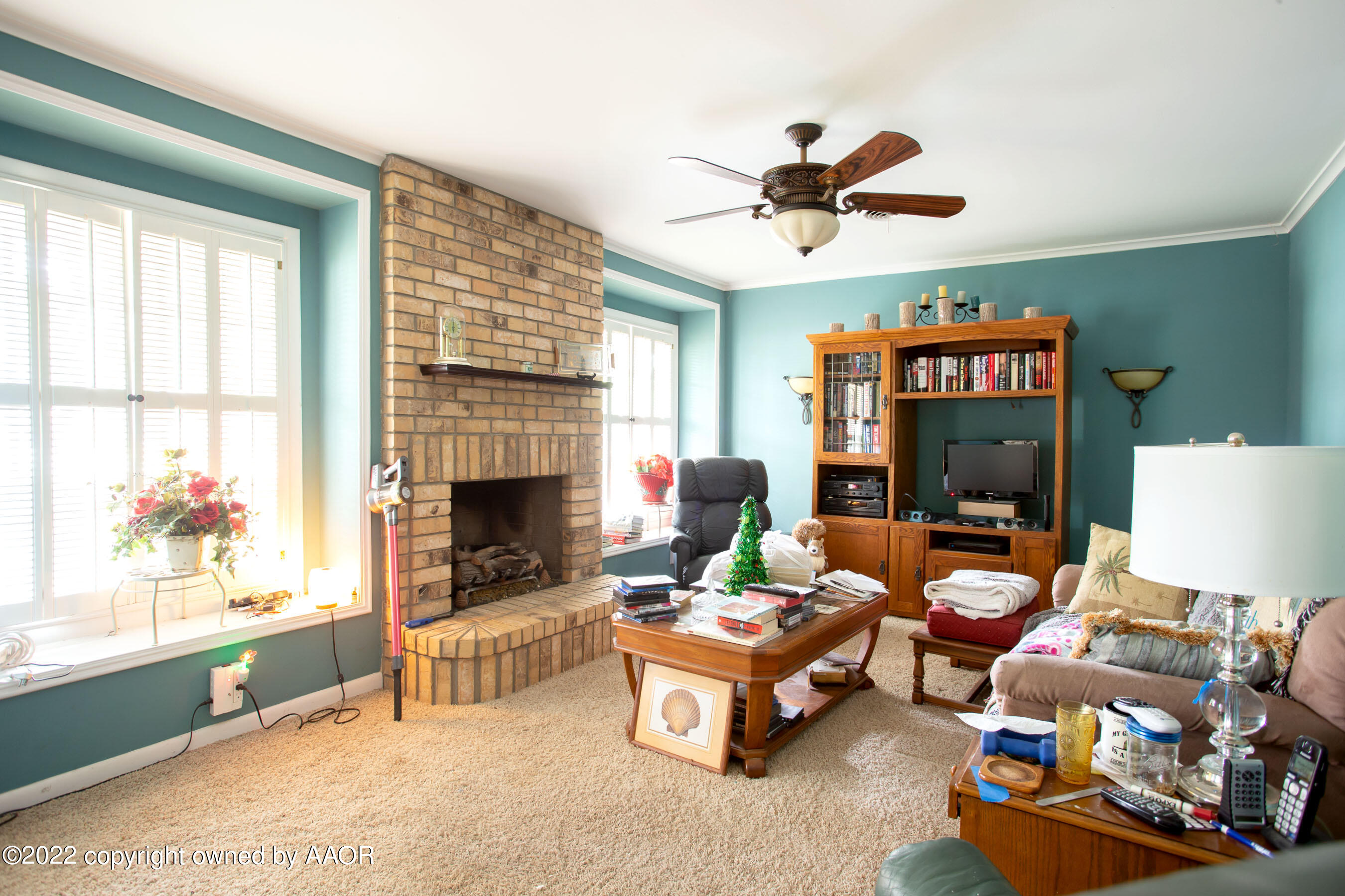 3607 Patterson Drive Amarillo, TX 79109 - Photo 5 of 24 a living room with furniture a fireplace and a window