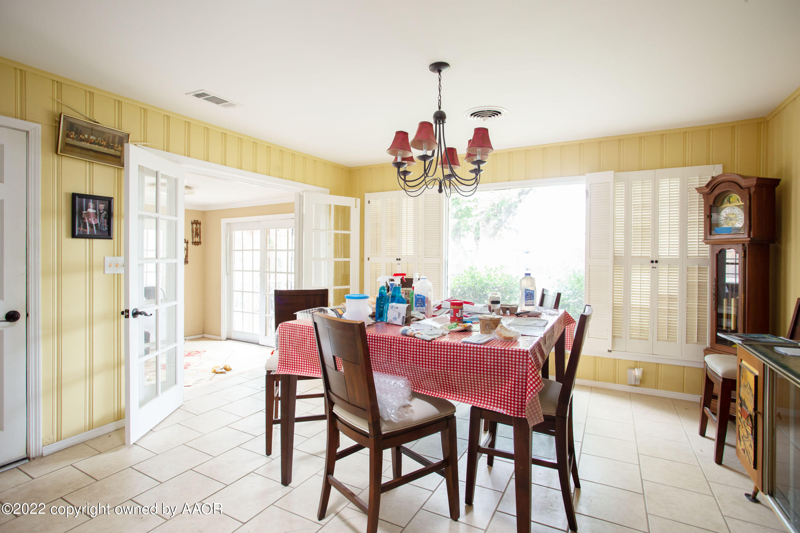 3607 Patterson Drive Amarillo, TX 79109 - Photo 9 of 24 a view of a dining room with furniture and a chandelier