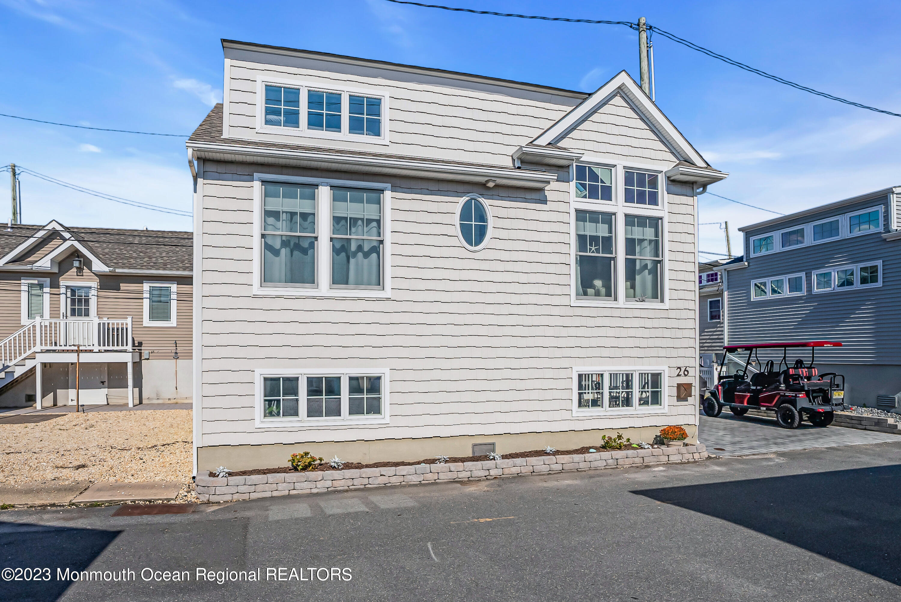 26 East Shell Way Lavallette, NJ 08735 - Photo 1 of 46 a front view of a house with a road