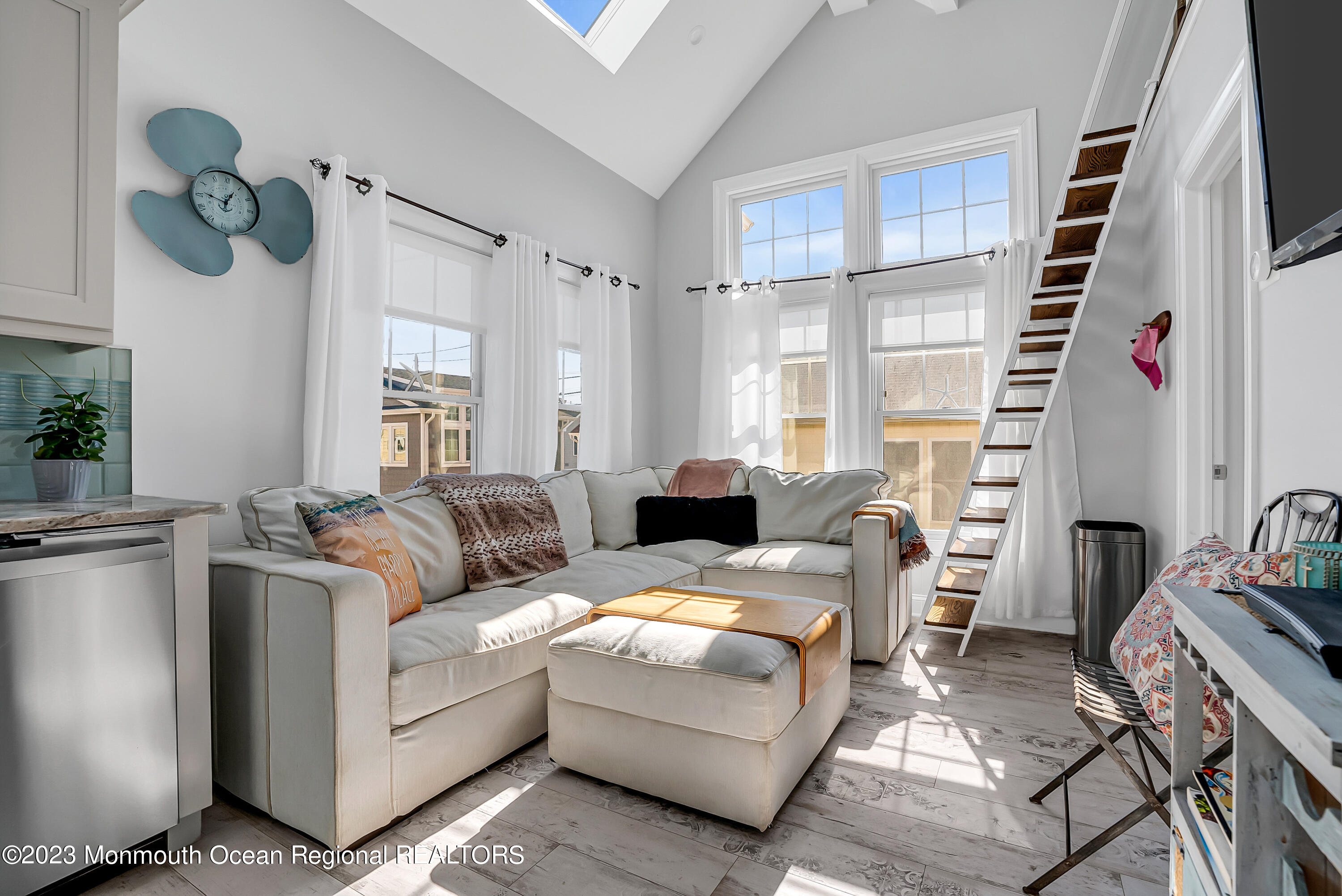 26 East Shell Way Lavallette, NJ 08735 - Photo 12 of 46 a living room with furniture and a large window