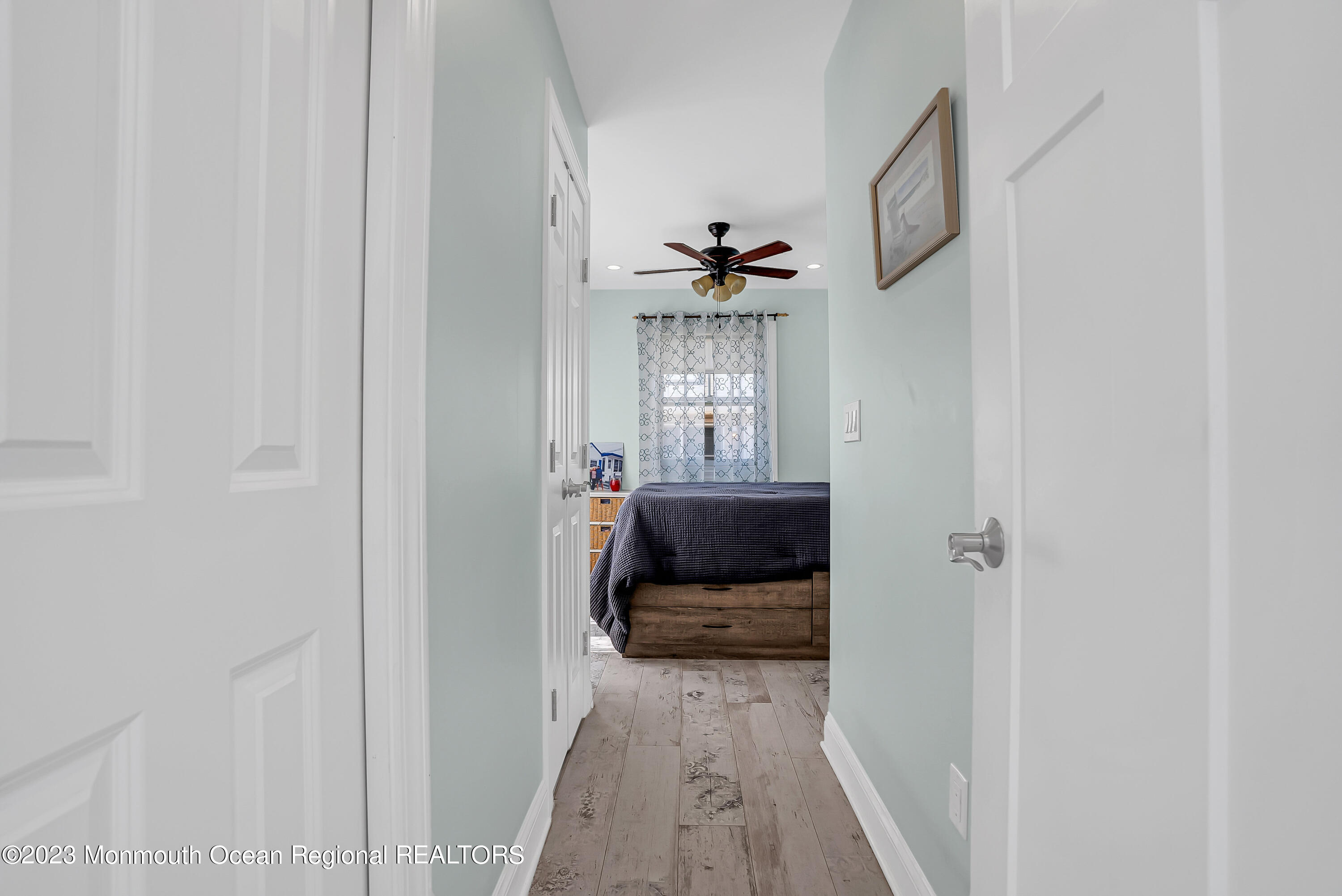 26 East Shell Way Lavallette, NJ 08735 - Photo 16 of 46 a view of a hallway view with wooden floor and staircase