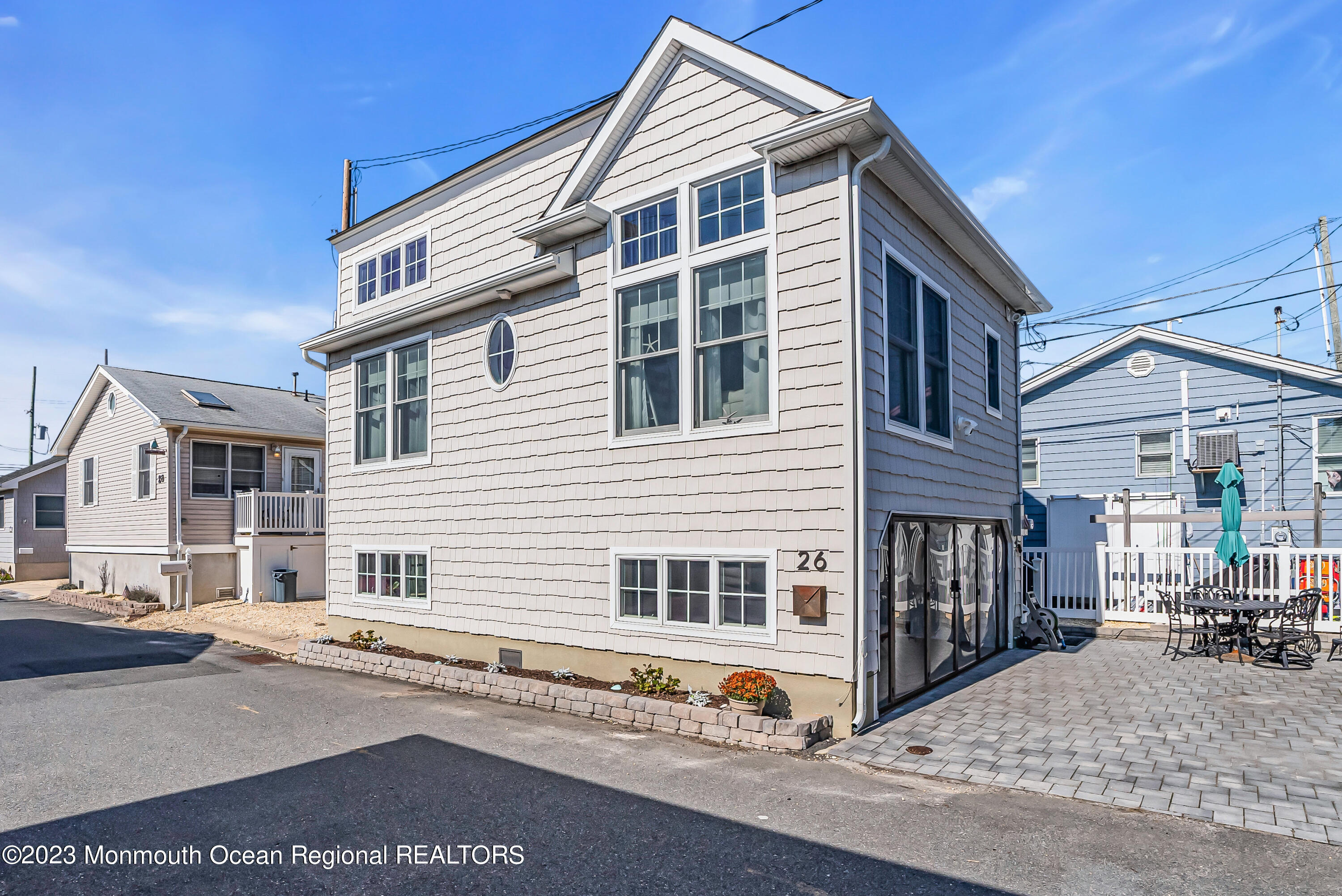 26 East Shell Way Lavallette, NJ 08735 - Photo 2 of 46 a front view of a house with a road